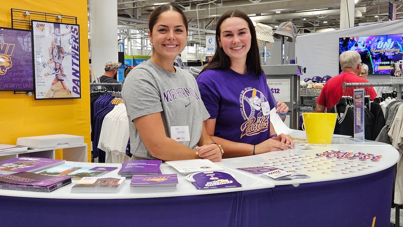 Volunteers at the UNII booth at the Iowa State Fair.